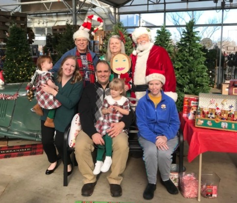 Judy Hodges with family at Christmas with Santa